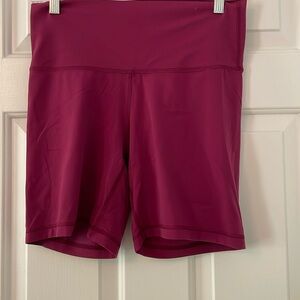 Aritzia TNaction Butter Biker shorts in magenta/burgundy. Large